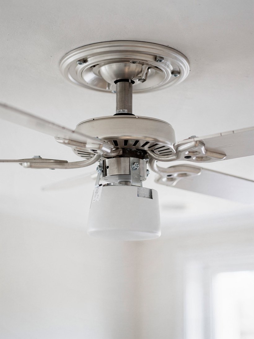 Technician installing a ceiling fan on a high ceiling in Las Vegas, NV